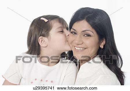 Close-up of a girl kissing her mother and smiling View Large Photo Image Stock Image - Close-up of a girl kissing her mother and smiling. Fotosearch