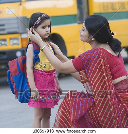 Side profile of a teacher talking to a schoolgirl View Large Photo Image Stock Image - Side profile of a teacher talking to a schoolgirl. Fotosearch