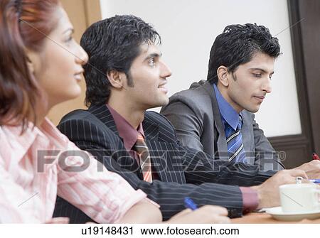 Business executives in a conference room View Large Photo Image Stock Image - Business executives in a conference room. Fotosearch