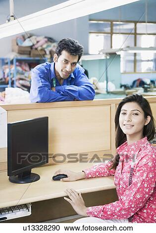 Portrait of two fashion designers in a textile industry View Large Photo Image Stock Image - Portrait of two fashion designers in a textile industry. Fotosearch