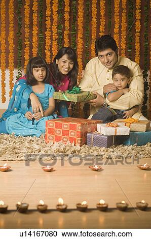 Stock Image - Children sitting with their parents. Fotosearch