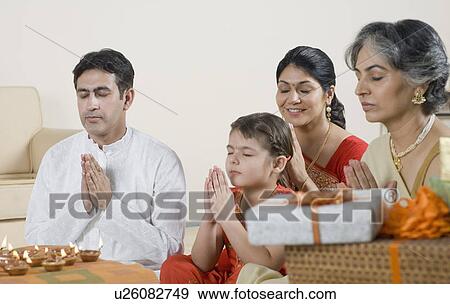 Stock Photo - Family performing Lakshmi pujan. Fotosearch