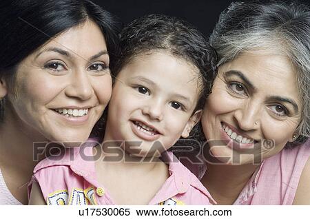 Portrait of a girl smiling with her mother and grandmother View Large Photo Image Stock Photography - Portrait of a girl smiling with her mother and grandmother. Fotosearch
