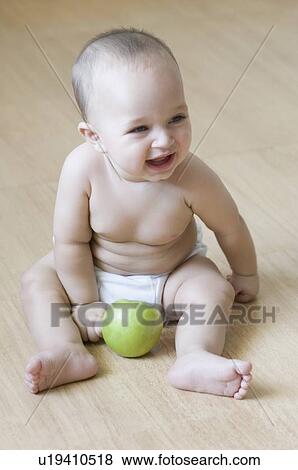 Baby boy sitting on the hardwood floor and laughing View Large Photo Image Stock Photo - Baby boy sitting on the hardwood floor and laughing. Fotosearch