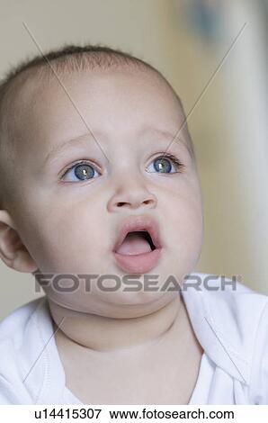 Close-up of a baby boy looking up View Large Photo Image Stock Photo - Close-up of a baby boy looking up. Fotosearch
