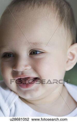 Close-up of a baby boy smiling View Large Photo Image Stock Image - Close-up of a baby boy smiling. Fotosearch