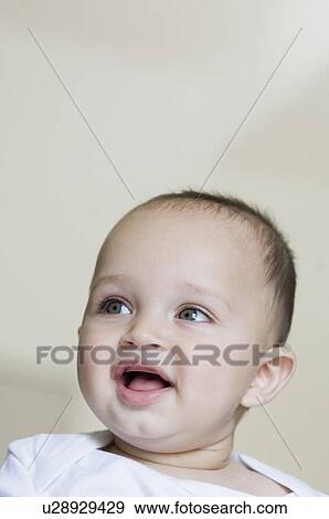 Stock Photo - Close-up of a baby boy smiling. Fotosearch