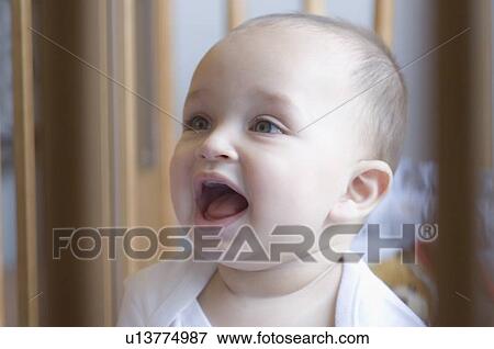 Stock Photo - Close-up of a baby laughing. Fotosearch