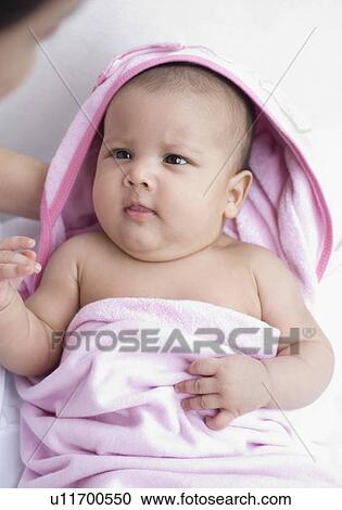 Stock Image - Close-up of a person caring a baby boy. Fotosearch