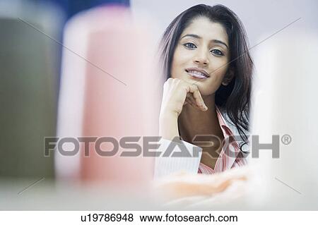 Stock Photo - Portrait of a female fashion designer smiling. Fotosearch
