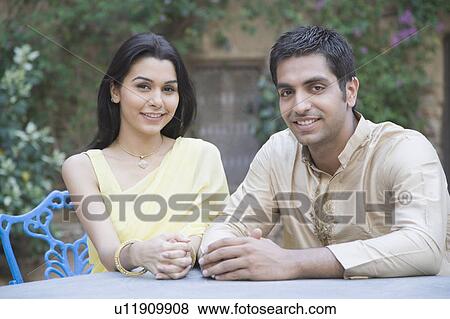 Portrait of a young couple smiling View Large Photo Image Stock Photo - Portrait of a young couple smiling. Fotosearch