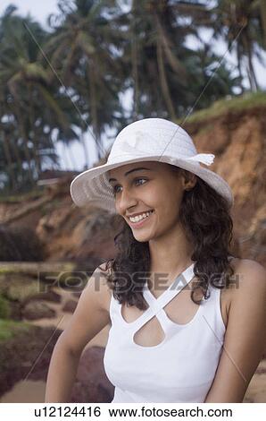 Stock Photograph - Close-up of a young woman smiling, Goa, India. Fotosearch