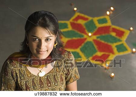 Stock Image - Portrait of a young woman smiling. Fotosearch