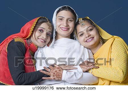 Portrait of three young women smiling View Large Photo Image Stock Photograph - Portrait of three young women smiling. Fotosearch