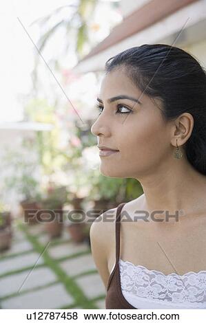 Close-up of a young woman View Large Photo Image Stock Photo - Close-up of a young woman. Fotosearch