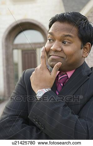 Close-up of a mid adult man smirking View Large Photo Image Stock Image - Close-up of a mid adult man smirking. Fotosearch