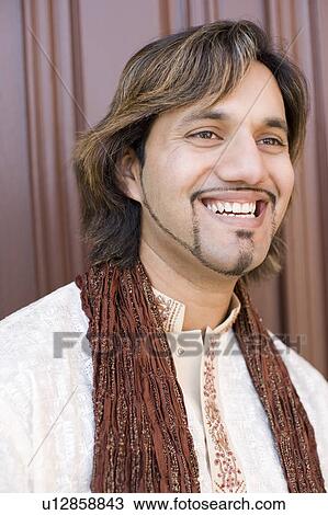Close-up of a young man smiling View Large Photo Image Stock Image - Close-up of a young man smiling. Fotosearch
