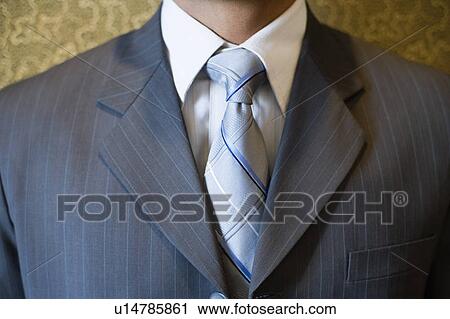 Mid section view of a businessman View Large Photo Image Stock Image - Mid section view of a businessman. Fotosearch