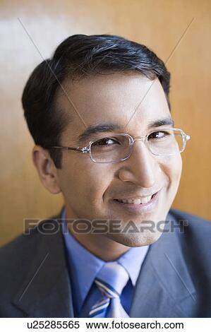 Stock Photography - Portrait of a businessman smiling. Fotosearch