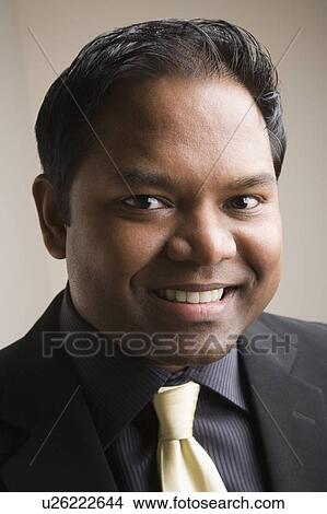 Portrait of a mid adult man smiling View Large Photo Image Picture - Portrait of a mid adult man smiling. Fotosearch