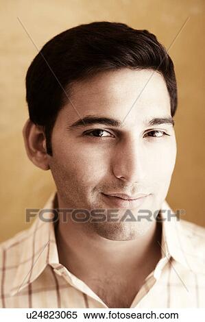 Portrait of a young man smiling View Large Photo Image Stock Photography - Portrait of a young man smiling. Fotosearch