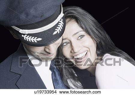 Picture - Close-up of a young couple smiling. Fotosearch