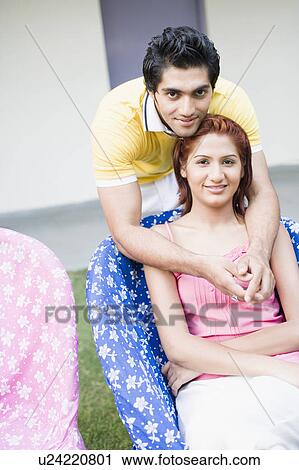 Portrait of a young couple smiling View Large Photo Image Stock Image - Portrait of a young couple smiling. Fotosearch