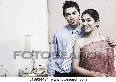 Portrait of a young couple smiling View Large Photo Image Picture - Portrait of a young couple smiling. Fotosearch