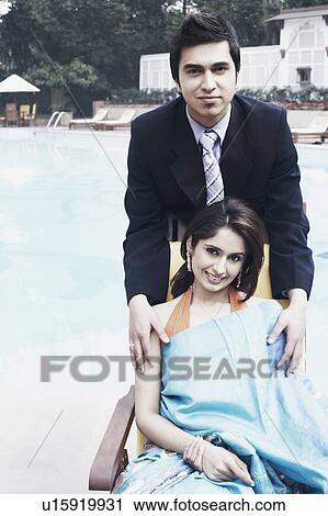 Portrait of a young couple smiling View Large Photo Image Stock Image - Portrait of a young couple smiling. Fotosearch