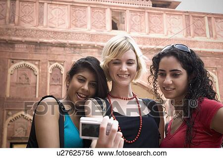 Close-up of three young women taking a picture of themselves, Taj Mahal, Agra, Uttar Pradesh, India View Large Photo Image Stock Photograph - Close-up of three young women taking a picture of themselves, Taj Mahal, Agra, Uttar Pradesh, India. Fotosearch