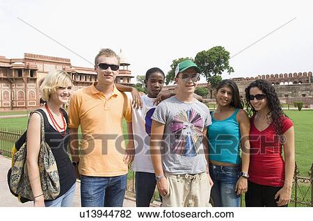 Portrait of three young couples standing in front of a mausoleum, Taj Mahal, Agra, Uttar Pradesh, India View Large Photo Image Stock Image - Portrait of three young couples standing in front of a mausoleum, Taj Mahal, Agra, Uttar Pradesh, India. Fotosearch