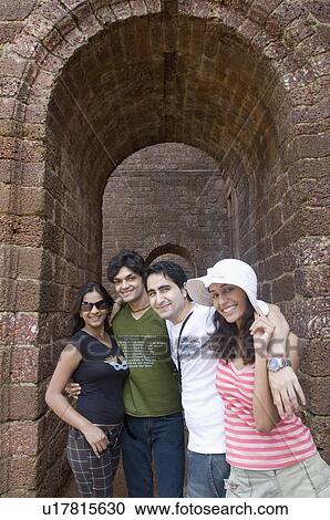 Portrait of two young couples standing together and smiling, Goa, India View Large Photo Image Stock Image - Portrait of two young couples standing together and smiling, Goa, India. Fotosearch