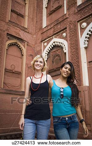 Portrait of two young women standing together and smiling, Taj Mahal, Agra, Uttar Pradesh, India View Large Photo Image Stock Image - Portrait of two young women standing together and smiling, Taj Mahal, Agra, Uttar Pradesh, India. Fotosearch