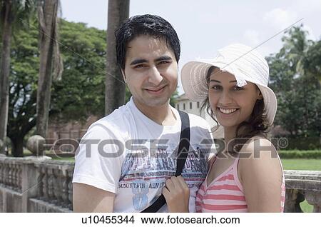 Portrait of a young couple smiling, Goa, India View Large Photo Image Picture - Portrait of a young couple smiling, Goa, India. Fotosearch