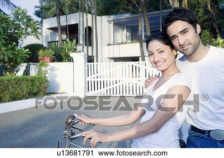 Portrait of a young couple smiling View Large Photo Image Stock Image - Portrait of a young couple smiling. Fotosearch