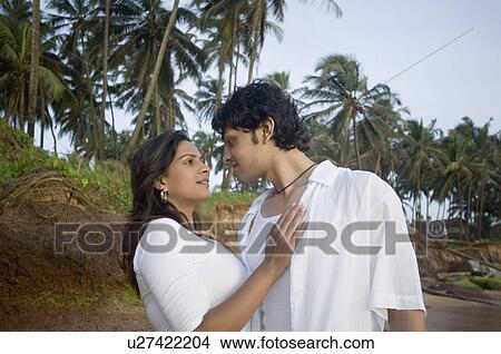 Young couple face to face on the beach, Goa, India View Large Photo Image Picture - Young couple face to face on the beach, Goa, India. Fotosearch