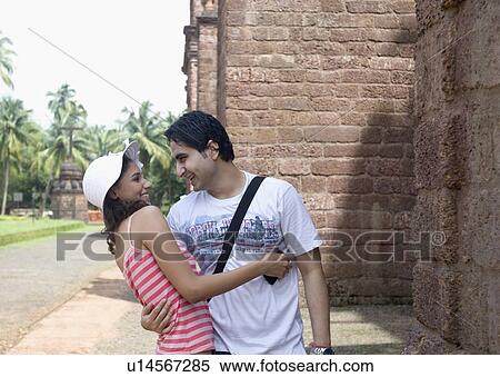 Young couple romancing and smiling, Goa, India View Large Photo Image Stock Photography - Young couple romancing and smiling, Goa, India. Fotosearch