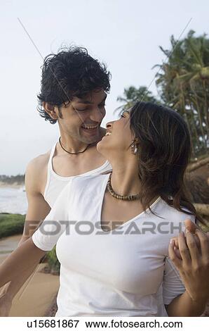 Young couple romancing on the beach, Goa, India View Large Photo Image Stock Photo - Young couple romancing on the beach, Goa, India. Fotosearch