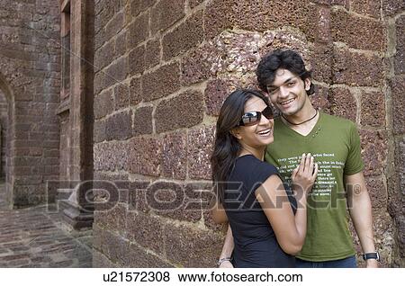 Young couple smiling together View Large Photo Image Stock Photo - Young couple smiling together. Fotosearch