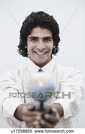 Portrait of a businessman holding a globe View Large Photo Image Stock Photography - Portrait of a businessman holding a globe. Fotosearch