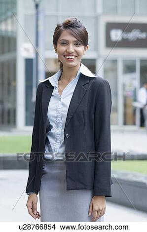 Portrait of a businesswoman smiling, Singapore View Large Photo Image Picture - Portrait of a businesswoman smiling, Singapore. Fotosearch