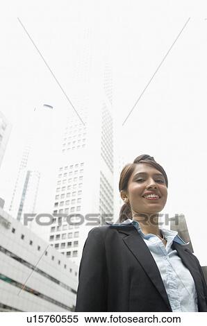 Portrait of a businesswoman smiling, Singapore View Large Photo Image Stock Photography - Portrait of a businesswoman smiling, Singapore. Fotosearch