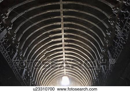 Stock Image - Low angle view of a cave, Buddhist Chaitya Hall, Ellora, Aurangabad, Maharashtra, India. Fotosearch