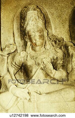 Stock Photo - Statue in a cave, Ellora, Aurangabad, Maharashtra, India. Fotosearch