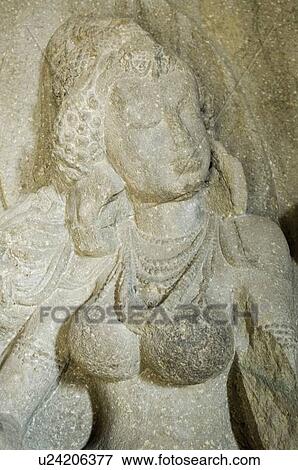 Statue in a cave, Ellora, Aurangabad, Maharashtra, India View Large Photo Image Stock Photo - Statue in a cave, Ellora, Aurangabad, Maharashtra, India. Fotosearch