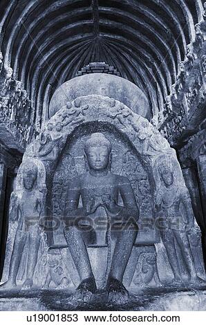 Stock Image - Statue of Buddha in a cave, Buddhist Chaitya Hall, Ellora, Aurangabad, Maharashtra, India. Fotosearch