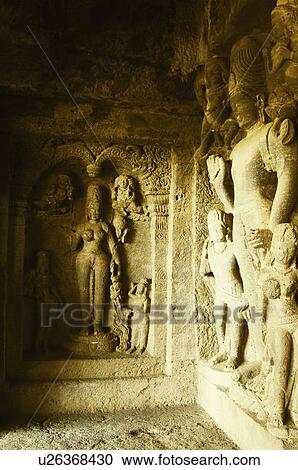 Statues carved on the wall in a cave, Ellora, Aurangabad, Maharashtra, India View Large Photo Image Stock Image - Statues carved on the wall in a cave, Ellora, Aurangabad, Maharashtra, India. Fotosearch