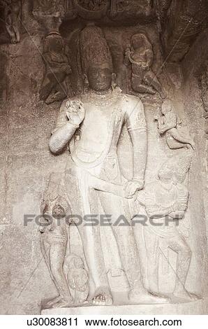 Statues carved on the wall in a cave, Ellora, Aurangabad, Maharashtra, India View Large Photo Image Stock Image - Statues carved on the wall in a cave, Ellora, Aurangabad, Maharashtra, India. Fotosearch