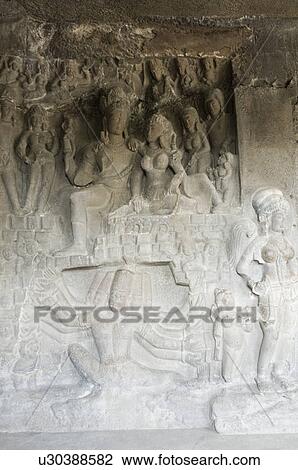 Statues carved on the wall in a cave, Ellora, Aurangabad, Maharashtra, India View Large Photo Image Stock Image - Statues carved on the wall in a cave, Ellora, Aurangabad, Maharashtra, India. Fotosearch