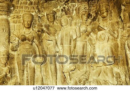 Stock Photo - Statues carved on the wall in a cave, Ellora, Aurangabad, Maharashtra, India. Fotosearch